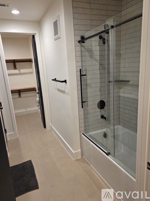 A room with wooden flooring and a ceiling fan.