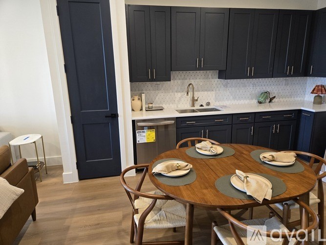 A kitchen with a table set for two.