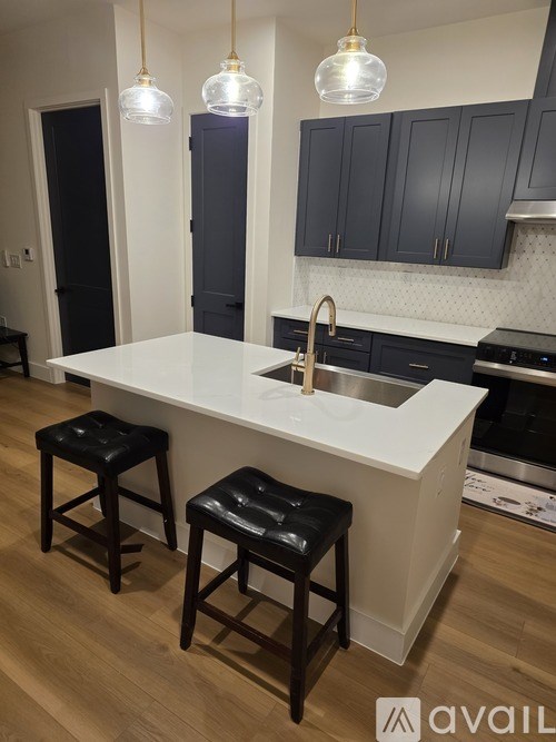 A building with a mix of black, beige, and red bricks.