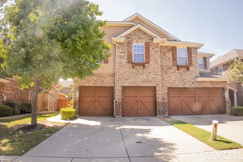 A house with a brown garage door is for sale.