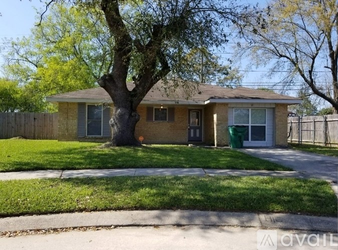 A house with a tree in front of it.
