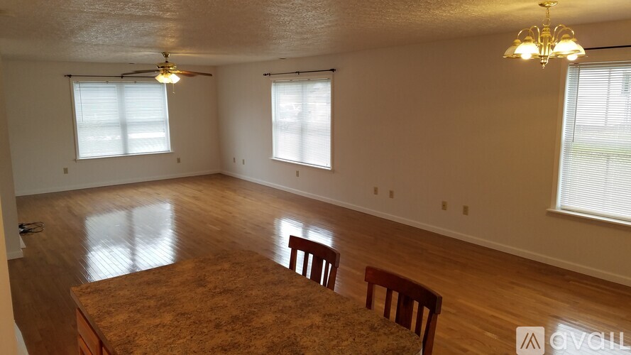 A room with a table and two chairs in it.