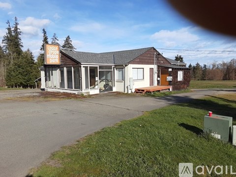 A building with a sign that says "Cedar Grove Mobile Home Park".