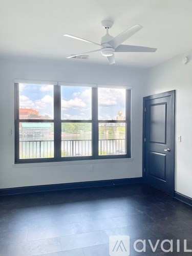 A bathroom with a toilet, sink, and mirror.