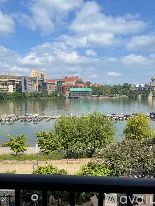 A courtyard with a brick floor and tables and chairs.