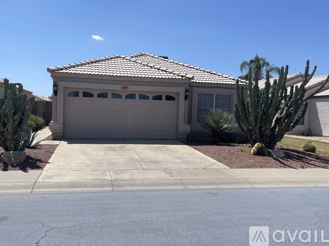 A house with a cactus in front of it.
