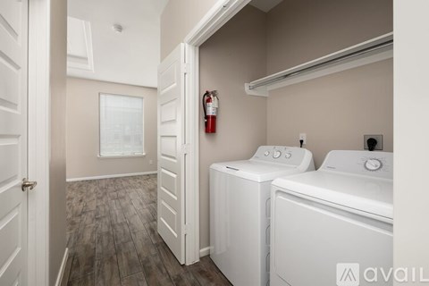 A laundry room with a washer and dryer.