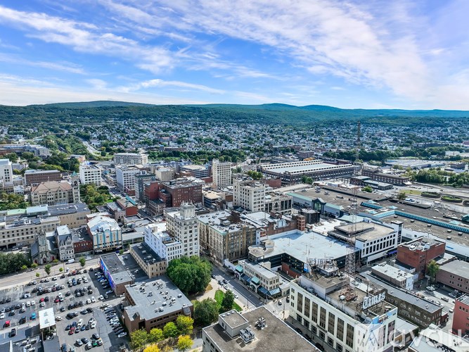 A cityscape with buildings and a clear sky.