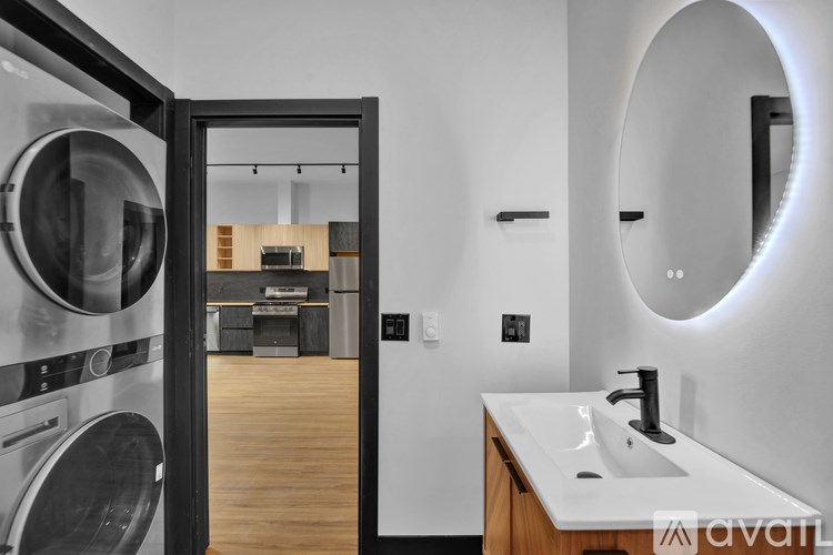 A cityscape with buildings and a sunset in the background.