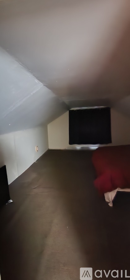 A room with a flat screen TV mounted on the wall.