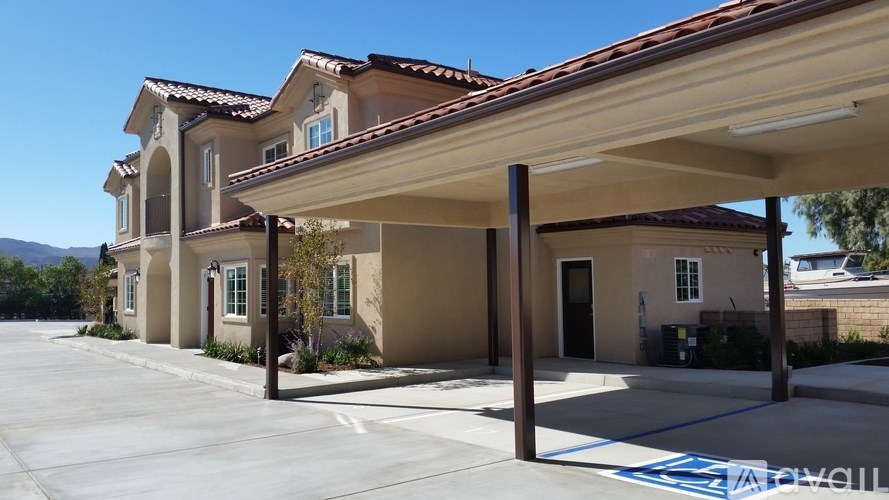 A row of houses with a clear blue sky above them.