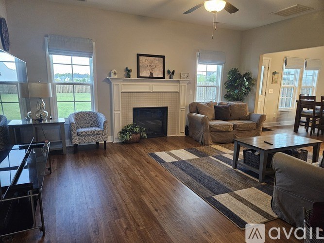 A living room with a fireplace and a couch.