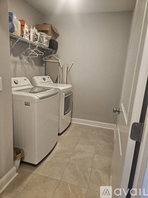 A laundry room with a washer and dryer.