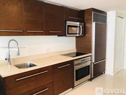A kitchen with brown cabinets and a white countertop.