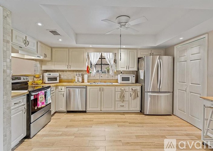 Two aerial images of a residential area with a purple arrow pointing to a specific location in each image.