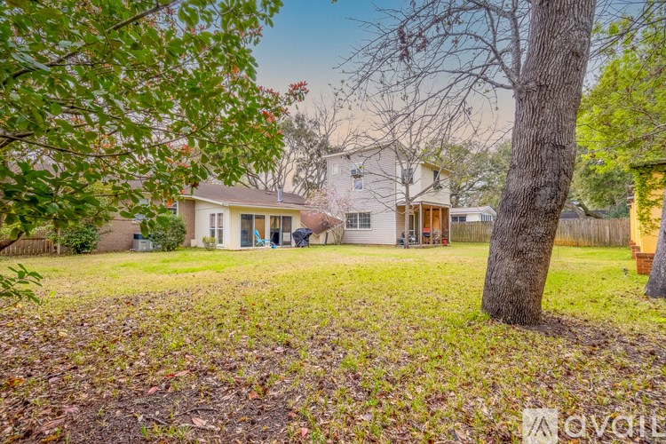 A house with a tree in front of it.