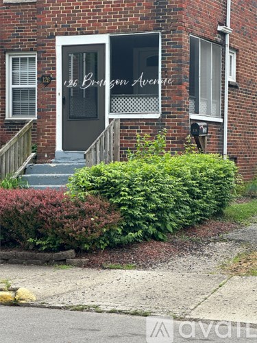 A brick house with a sign that says 126 Bridgman Avenue.