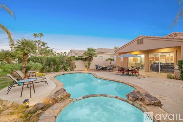 A house with a pool in the backyard.