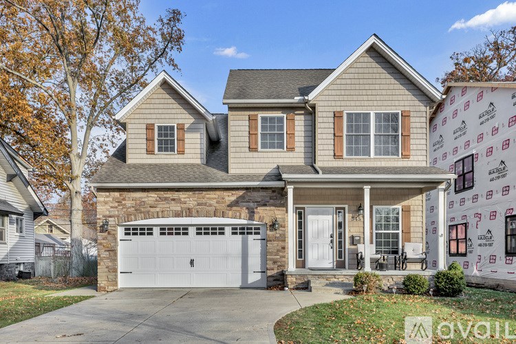 A house with a garage is for sale.