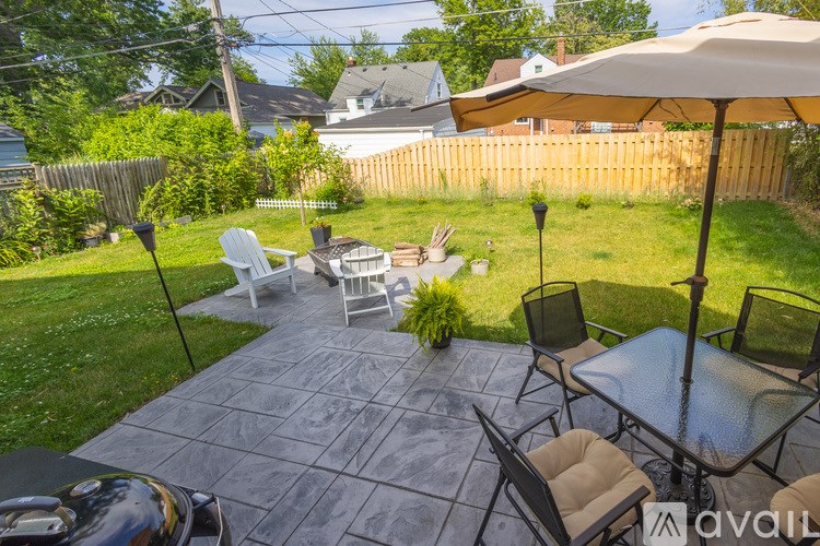 A house with a garage and a flag on the front porch.