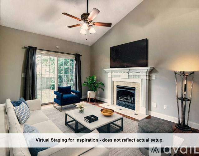 A patio with a table and chairs is set up on a tiled floor.