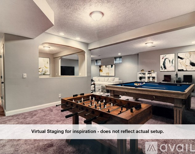 A small laundry room with a washer and dryer.