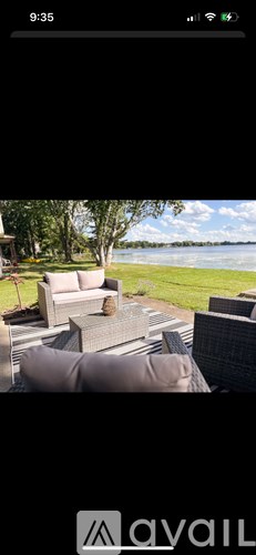 A patio with a couch and a table is shown.
