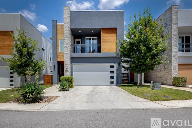 A modern house with a garage is available for sale.