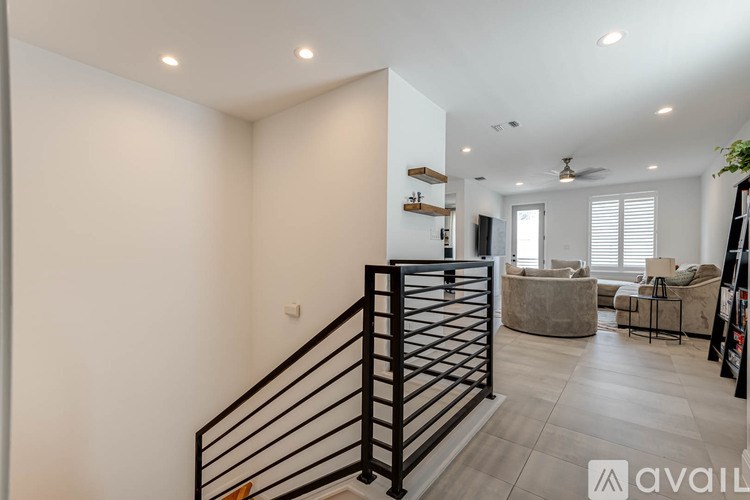 A living room with a staircase leading to the upper floor.