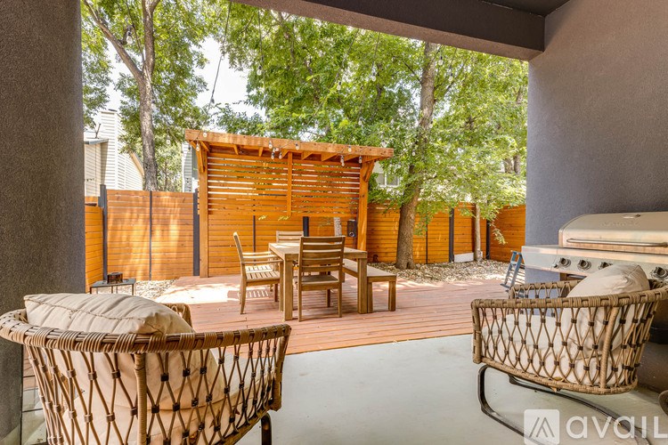 A patio with a table and chairs is available for rent.