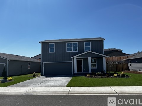A house with a garage is available for sale.