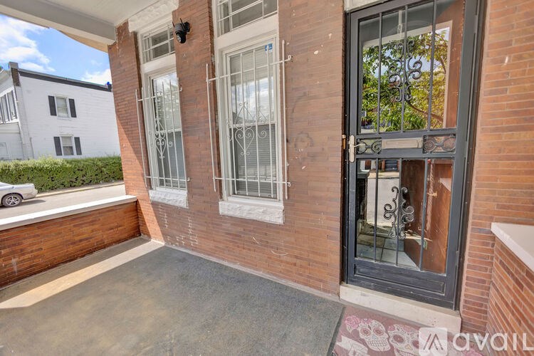 A house with a black door and a glass window.