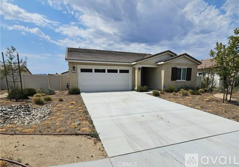 A house with a garage is for sale.