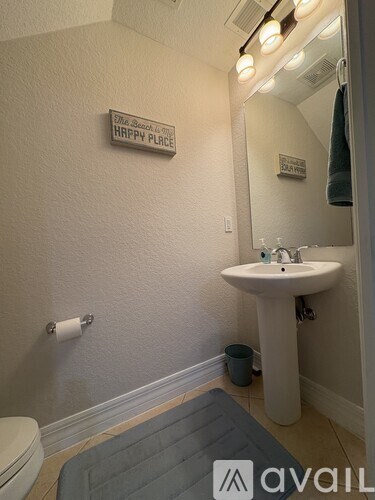 A bathroom with a sign that says Happy Place.