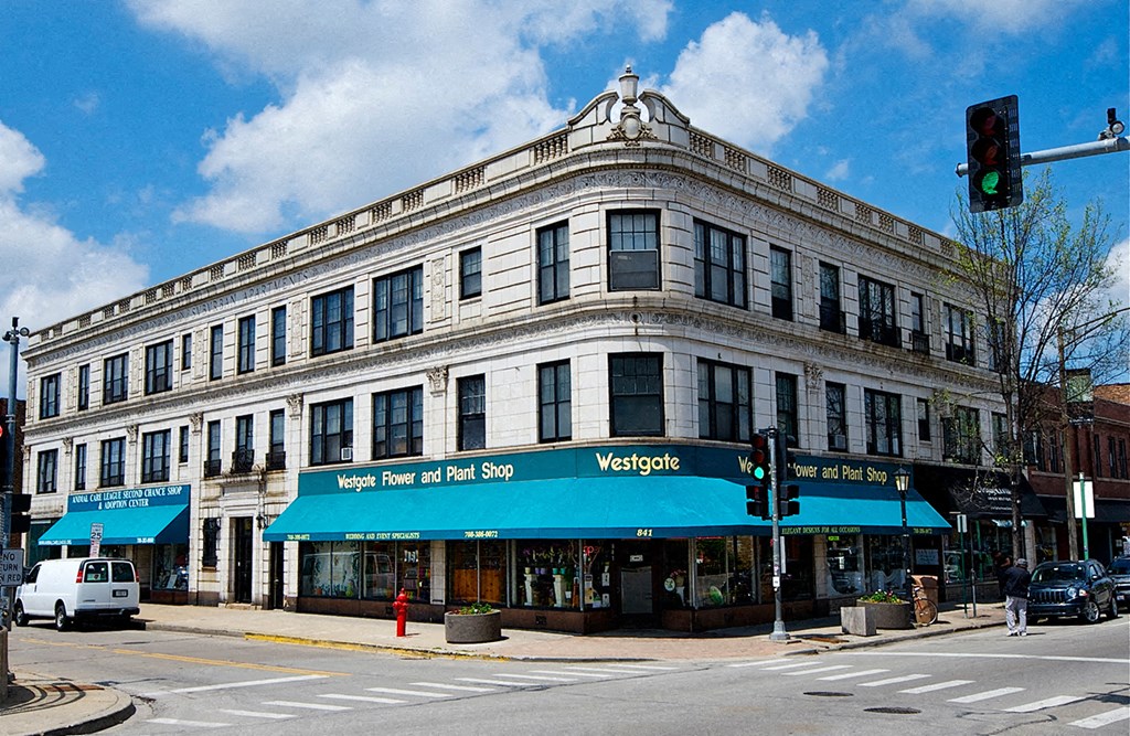 a large building on the corner of a city street