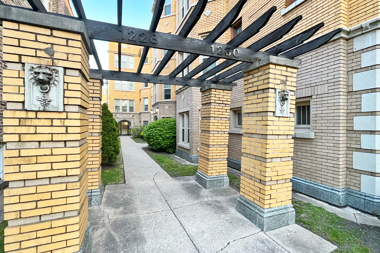 A building with a lion head decoration on the wall.