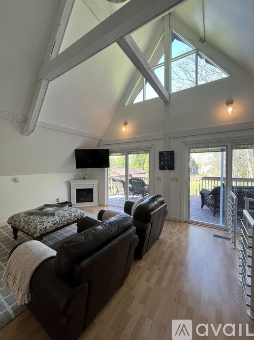 A living room with a fireplace and a couch.