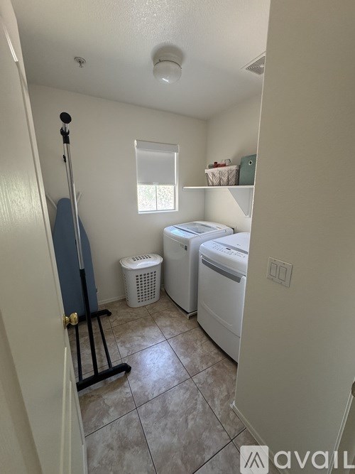 A laundry room with a washer and dryer.