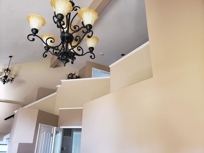 A chandelier with six lights hangs from the ceiling.