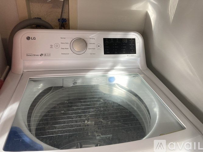 The front of an LG washing machine with the door open.