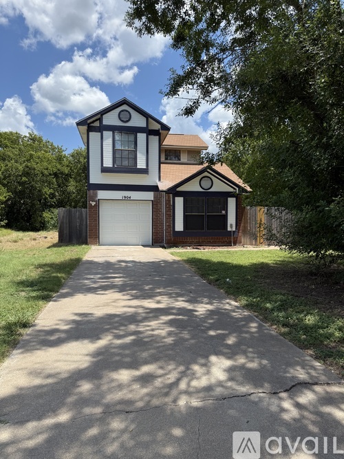 A house with a garage is for sale.