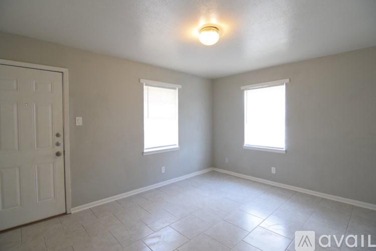 A room with a toilet visible through the open door.