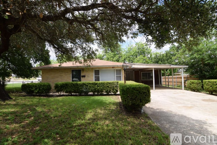 A house with a tree in front of it.