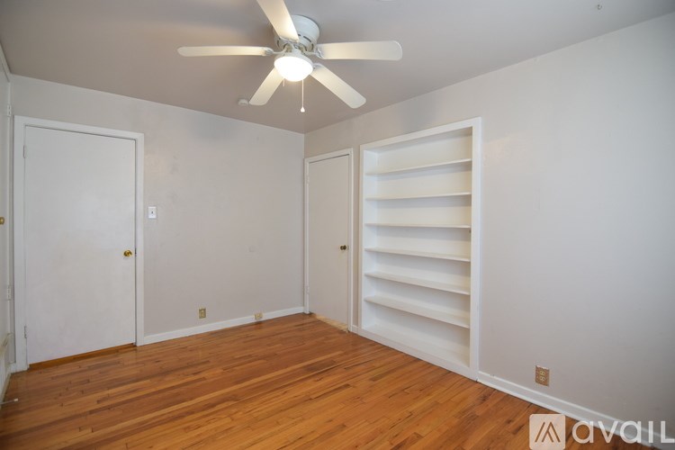 A room with a chandelier, two windows, and a wooden wardrobe is available for rent.