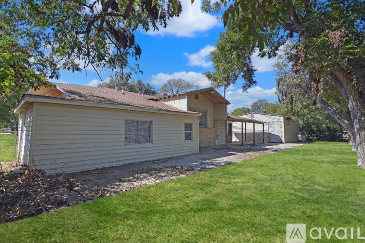 A house with a tree in front of it.