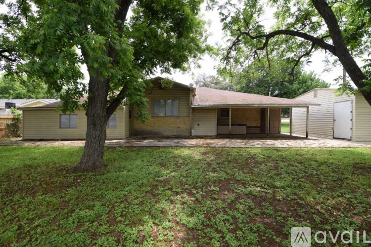 A house with a tree in front of it.