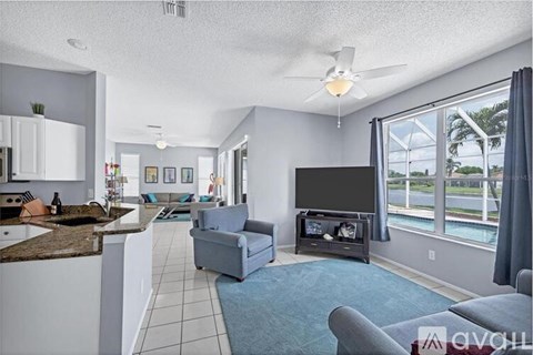 A living room with a television and a couch.