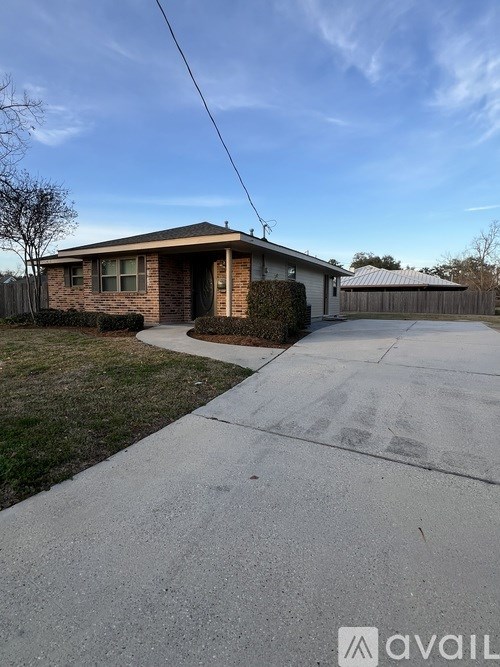 A house with a driveway in front of it.