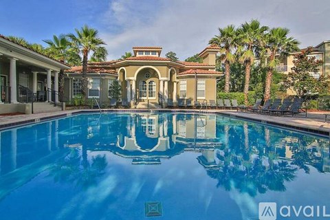 A pool in front of a house with a sign that says "available".