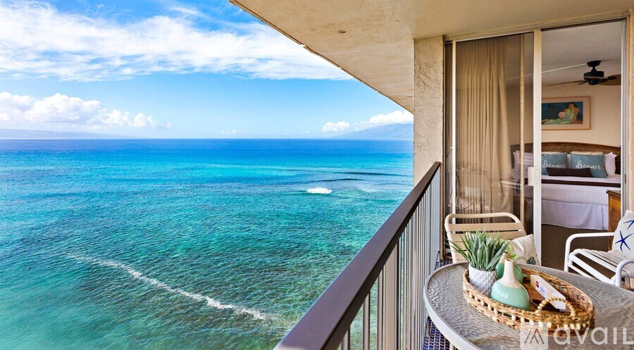 A balcony overlooks a beautiful ocean view.